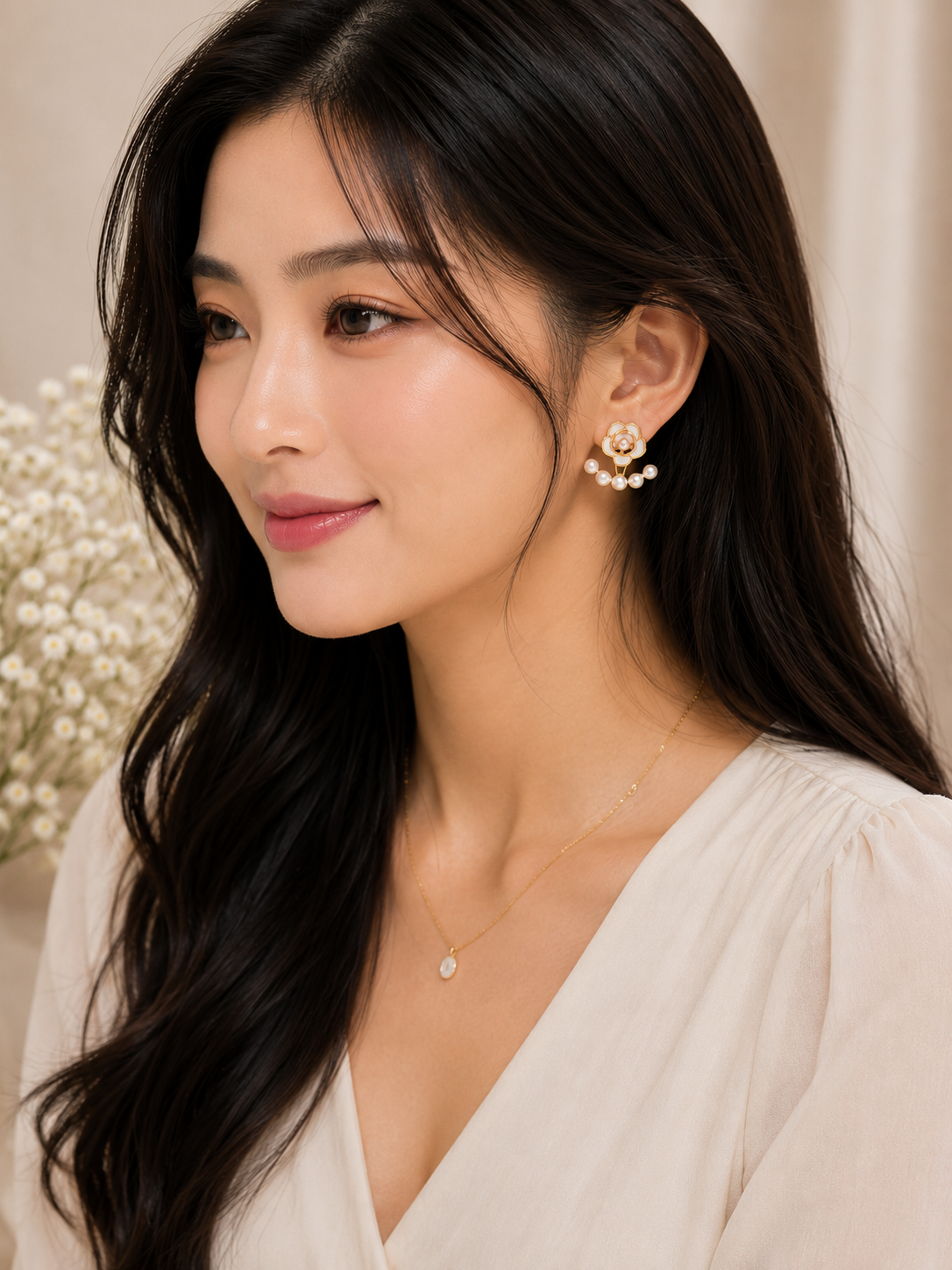 Model wearing ELORIA rose pearl cascade earrings