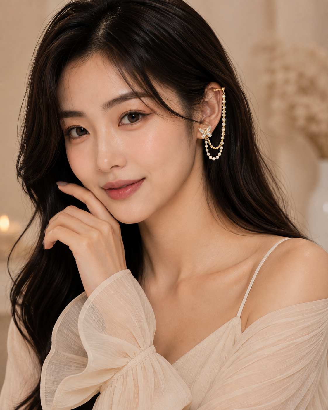 Model wearing Celeste Butterfly Ear Cuff with crystal butterfly and pearl chain