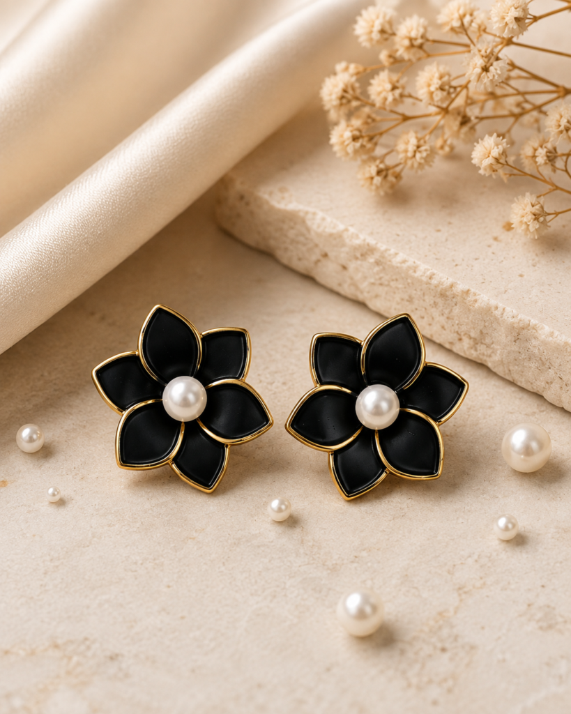 Noir Pearl Rose Earrings in black and gold with pearl center