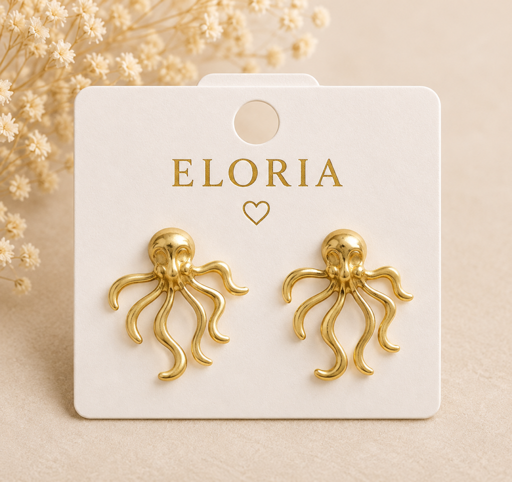 Aurelia Octopus Earrings by ELORIA displayed on an elegant ivory jewelry card