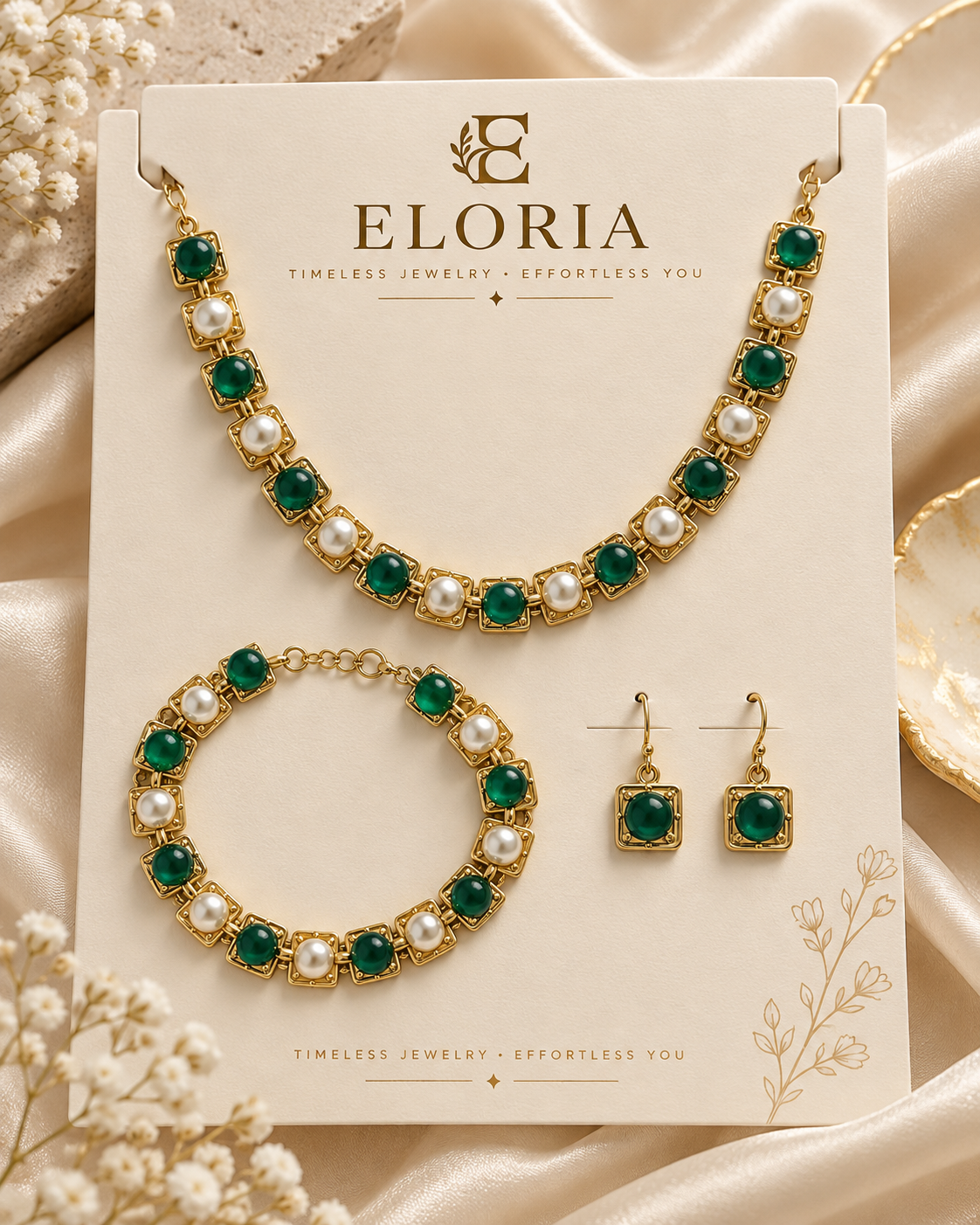 Emerald Pearl Élan jewelry set with green stones and pearl accents on ELORIA display card